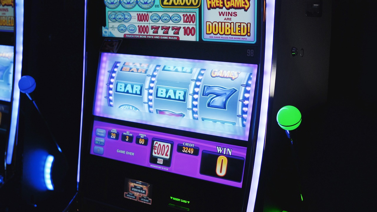 Row of glowing casino slot machines with golden lights