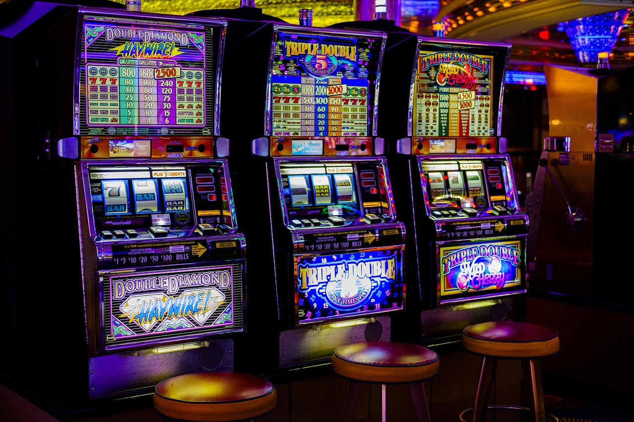 Row of casino slot machines showing frequency of payout