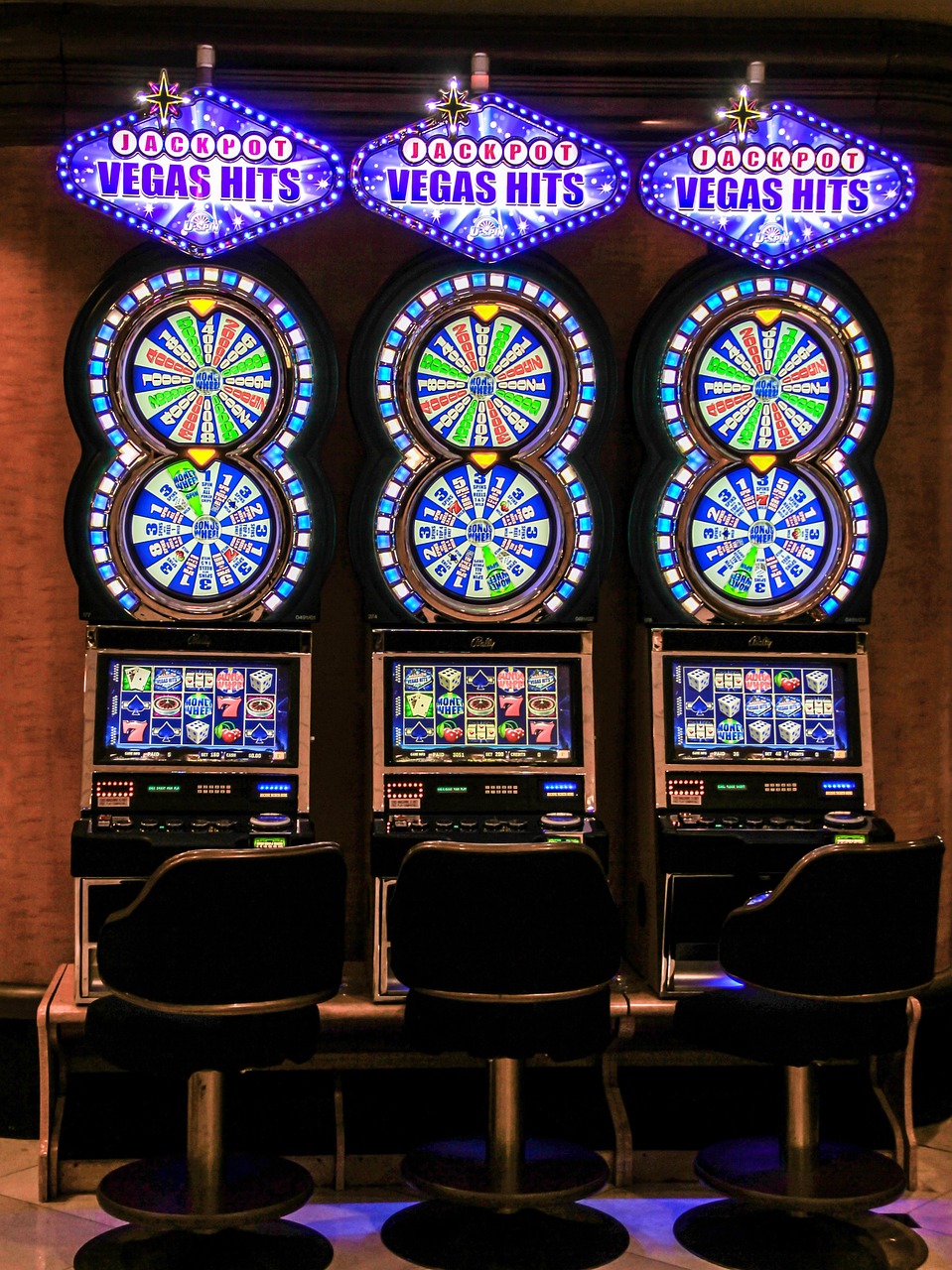 Vertical view of a classic casino slot machine with bright lights